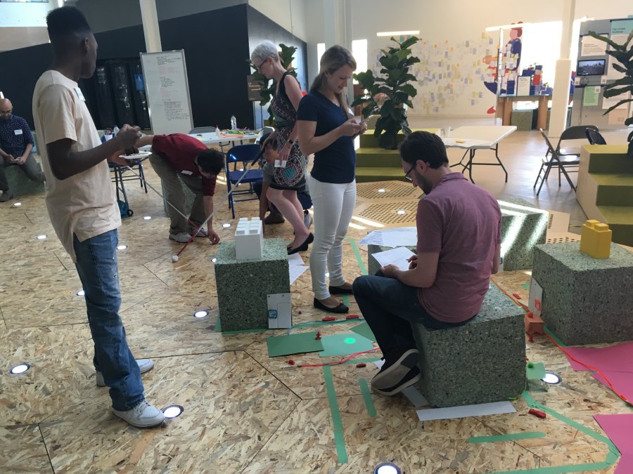 The "Harmony" and "Side Thought" groups engaging in conversation and providing each other feedback during the "swap and critique" session