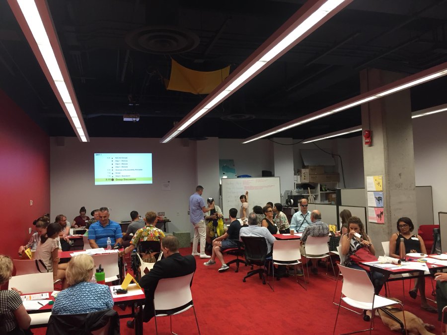 Participants at the event sitting in small groups