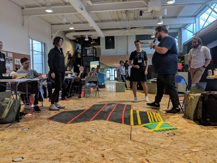 Participants providing a demonstration of their Rumble Pavement design to other groups